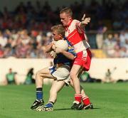 1 September 2002; Declan Reilly of Longford is tackled by Ciaran Mullan of Derry during the All-Ireland Minor Football Championship Semi-Final match between Longford and Derry at Croke Park in Dublin. Photo by Pat Murphy/Sportsfile