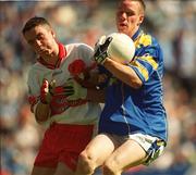 1 September 2002; Declan Farrell of Longford is tackled by Joe Keenan of Derry during the All-Ireland Minor Football Championship Semi-Final match between Longford and Derry at Croke Park in Dublin. Photo by Brian Lawless/Sportsfile
