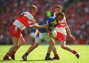 1 September 2002; Enda Williams of Longford is tackled by Patsy Bradley and Ciaran McCallon of Derry during the All-Ireland Minor Football Championship Semi-Final match between Longford and Derry at Croke Park in Dublin. Photo by Brian Lawless/Sportsfile