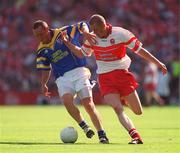 1 September 2002; Enda Willams of Longford is tackled by Patsy Bradley of Derry during the All-Ireland Minor Football Championship Semi-Final match between Longford and Derry at Croke Park in Dublin. Photo by Pat Murphy/Sportsfile