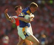 1 September 2002; Fergus Kelly of Longford is tackled by Ciaran McCallon of Derry during the All-Ireland Minor Football Championship Semi-Final match between Longford and Derry at Croke Park in Dublin. Photo by Brian Lawless/Sportsfile