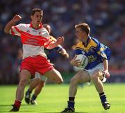 1 September 2002; Declan Reilly of Longford is tackled by Ciaran McCallon of Derry during the All-Ireland Minor Football Championship Semi-Final match between Longford and Derry at Croke Park in Dublin. Photo by Pat Murphy/Sportsfile