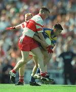 1 September 2002; Diarmuid Hegarty of Longford is tackled by Michael McGoldrick of Derry during the All-Ireland Minor Football Championship Semi-Final match between Longford and Derry at Croke Park in Dublin. Photo by Ray McManus/Sportsfile