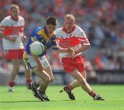1 September 2002; Emmett Finn of Longford is tackled by Cathal O'Kane of Derry during the All-Ireland Minor Football Championship Semi-Final match between Longford and Derry at Croke Park in Dublin. Photo by Brian Lawless/Sportsfile