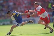 1 September 2002; Michael Hussey of Longford is tackled by Michael McGoldrick of Derry during the All-Ireland Minor Football Championship Semi-Final match between Longford and Derry at Croke Park in Dublin. Photo by Ray McManus/Sportsfile