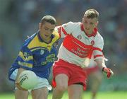 1 September 2002; Michael Hussey of Longford is tackled by Michael McGoldrick of Derry during the All-Ireland Minor Football Championship Semi-Final match between Longford and Derry at Croke Park in Dublin. Photo by Ray McManus/Sportsfile
