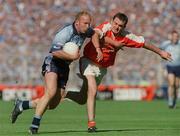 1 September 2002; Shane Ryan of Dublin is tackled by Aidan O'Rourke of Armagh during the Bank of Ireland All-Ireland Senior Football Championship Semi-Final match between Armagh and Dublin at Croke Park in Dublin. Photo by Pat Murphy/Sportsfile