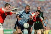 1 September 2002; Shane Ryan of Dublin is tackled by John McEntee, left, and Aidan O'Rourke of Armagh during the Bank of Ireland All-Ireland Senior Football Championship Semi-Final match between Armagh and Dublin at Croke Park in Dublin. Photo by Pat Murphy/Sportsfile