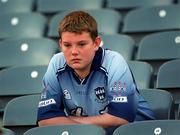 1 September 2002; A Dublin supporter dejected following his side's defeat in the Bank of Ireland All-Ireland Senior Football Championship Semi-Final match between Armagh and Dublin at Croke Park in Dublin. Photo by Brian Lawless/Sportsfile
