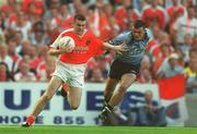 1 September 2002; Oisin McConville of Armagh in action against Paul Casey of Dublin during the Bank of Ireland All-Ireland Senior Football Championship Semi-Final match between Armagh and Dublin at Croke Park in Dublin. Photo by Damien Eagers/Sportsfile