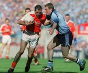 1 September 2002; Steven McDonnell of Armagh is tackled by Coman Goggins of Dublin during the Bank of Ireland All-Ireland Senior Football Championship Semi-Final match between Armagh and Dublin at Croke Park in Dublin. Photo by Pat Murphy/Sportsfile