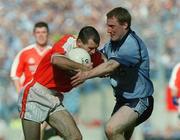 1 September 2002; Steven McDonnell of Armagh is tackled by Coman Goggins of Dublin during the Bank of Ireland All-Ireland Senior Football Championship Semi-Final match between Armagh and Dublin at Croke Park in Dublin. Photo by Pat Murphy/Sportsfile