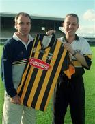 2 September 2002; Kilkenny hurler DJ Carey, left, presents Rob Howe, winner of the Guinness &quot;Giant Among Fans&quot; promotion, a signed Kilkenny jersey at Nowlan Park in Kilkenny. Photo by Damien Eagers/Sportsfile