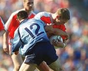 1 September 2002; Kieran McGeeney of Armagh in action against John McNally of Dublin during the Bank of Ireland All-Ireland Senior Football Championship Semi-Final match between Armagh and Dublin at Croke Park in Dublin. Photo by Damien Eagers/Sportsfile