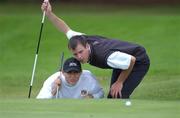 5 September 2002; Shane Gannon, Louth Golf Club, assisted by his brother and caddy David line up a putt on the 14th green during the Bulmers Junior Cup at Galway Golf Club in Galway. Photo by Ray McManus/Sportsfile