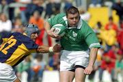 7 September 2002; Brian O'Driscoll of Ireland in action against Romeo Gontineac of Romania during the international friendly between Ireland and Romania at Thomond Park in Limerick. Photo by Matt Browne/Sportsfile