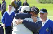 5 September 2002; Joe Cuff of The Island Golf Club, left, is embraced by his team-mate Paul Cullen after they had won the final of the Bulmers Jimmy Bruen Shield at Galway Golf Club in Galway. Photo by Ray McManus/Sportsfile
