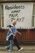 1 September 2002; Dublin supporters walk past a protest sign, in a residential area surrounding Croke Park, aimed at the GAA, on their way to the Bank of Ireland All-Ireland Senior Football Championship Semi-Final match between Armagh and Dublin at Croke Park in Dublin. Photo by Damien Eagers/Sportsfile
