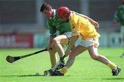 25 August 2002; Conor Fitzgerald of Limerick is tackled by Kevin Elliott of Antrim during the All-Ireland U21 Hurling Championship Semi-Final match between Antrim and Limerick at Parnell Park in Dublin. Photo by Aoife Rice/Sportsfile