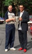 9 September 2002; Kilkenny senior captain Andy Comerford, with the Liam MacCarthy cup, meets former soccer player and actor Vinnie Jones, during a photocall at the Burlington Hotel in Dublin. Photo by Brendan Moran/Sportsfile