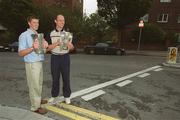 9 September 2002; Kilkenny minor captain Michael Rice, left, with the Irish Press cup, and Kilkenny senior captain Andy Comerford, with the Liam MacCarthy cup, during a photocall at the Burlington Hotel in Dublin, following their victories in the All-Ireland Finals. Photo by Brendan Moran/Sportsfile