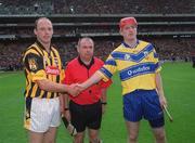 8 September 2002; Kilkenny captain Andy Comerford shakes hands with Clare captain Brian Lohan, in the presence of referee Aodan MacSuibhne, during the Guinness All-Ireland Senior Hurling Championship Final match between Kilkenny and Clare at Croke Park in Dublin. Photo by Ray McManus/Sportsfile