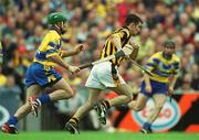 8 September 2002; Philip Larkin of Kilkenny in action against Alan Markham of Clare during the Guinness All-Ireland Senior Hurling Championship Final match between Kilkenny and Clare at Croke Park in Dublin. Photo by Brian Lawless/Sportsfile