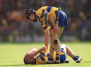 8 September 2002; David Forde of Clare attends to team-mate David Hoey during the Guinness All-Ireland Senior Hurling Championship Final match between Kilkenny and Clare at Croke Park in Dublin. Photo by Ray McManus/Sportsfile