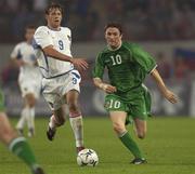 7 September 2002; Robbie Keane of Republic of Ireland in action against Andrey Karyaka of Russia during the UEFA European Championship 2004 Qualifier Group 10 match between Russia and Republic of Ireland at the Lokomotiv Moscow Stadium in Moscow, Russia. Photo by Brendan Moran/Sportsfile