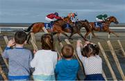 5 September 2017; Laytown neighbours, from left, Daniel Cole, age 6, Ciara Wasykiw, age 5, Conor Redden, age 3, and Eimear Cole, age 4, look on as Silk Cravat, with Colin Keane up, races ahead of Haraz, with Dougie Costello, and Live Twice, with Colm O'Donoghue up, in the Gilna's Cottage Inn Maiden during the Laytown Races at Laytown in Co Meath. Photo by Cody Glenn/Sportsfile