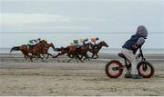 5 September 2017; Matthew Gallager, age 2, from Bettystown, Co Meath, follows the runners and riders as Monteverdi, with Kate Harrington up, races ahead of the field to win the Hibernia Steel Race during the Laytown Races at Laytown in Co Meath. Photo by Cody Glenn/Sportsfile