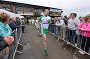 3 June 2012; London captain Sean McVeigh leads his team out onto the pitch for the start of the game. Connacht GAA Football Senior Championship Quarter-Final, London v Leitrim, Emerald Park, Ruislip, London. Picture credit: Diarmuid Greene / SPORTSFILE