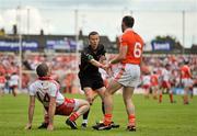 10 June 2012; Referee Joe McQuillan intervenes between captains Armagh's Ciaran McKeever and Tyrone's Stephen O'Neill. Ulster GAA Football Senior Championship, Quarter-Final, Armagh v Tyrone, Morgan Athletic Grounds, Armagh. Picture credit: Brian Lawless / SPORTSFILE