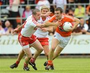 10 June 2012; Brendan Donaghy, Armagh, in action against Stephen O'Neill, left, and Owen Mulligan, Tyrone. Ulster GAA Football Senior Championship, Quarter-Final, Armagh v Tyrone, Morgan Athletic Grounds, Armagh. Picture credit: Brian Lawless / SPORTSFILE