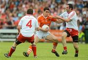 10 June 2012; Caolan Rafferty, Armagh, in action against Dermot Carlin, left, and Ronan McNabb, Tyrone. Ulster GAA Football Senior Championship, Quarter-Final, Armagh v Tyrone, Morgan Athletic Grounds, Armagh. Picture credit: Brian Lawless / SPORTSFILE