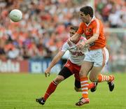 10 June 2012; Dermot Carlin, Tyrone, in action against Brian Mallon, Armagh. Ulster GAA Football Senior Championship, Quarter-Final, Armagh v Tyrone, Morgan Athletic Grounds, Armagh. Picture credit: Brian Lawless / SPORTSFILE