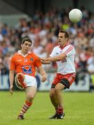 10 June 2012; Brian Mallon, Armagh, in action against Mark Donnelly, Tyrone. Ulster GAA Football Senior Championship, Quarter-Final, Armagh v Tyrone, Morgan Athletic Grounds, Armagh. Picture credit: Brian Lawless / SPORTSFILE