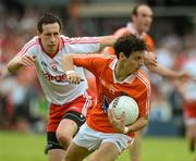 10 June 2012; Jamie Clarke, Armagh, in action against Colm Cavanagh, Tyrone. Ulster GAA Football Senior Championship, Quarter-Final, Armagh v Tyrone, Morgan Athletic Grounds, Armagh. Picture credit: Brian Lawless / SPORTSFILE