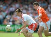 10 June 2012; Padraig Hampsey, Tyrone, in action against Ethan Rafferty, Armagh. Electric Ireland Ulster GAA Football Minor Championship, Quarter-Final, Armagh v Tyrone, Morgan Athletic Grounds, Armagh. Picture credit: Brian Lawless / SPORTSFILE