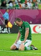 14 June 2012; Dejected Republic of Ireland player Richard Dunne after Spain's Fernando Torres scored his side's third goal of the game after seventy minutes. EURO2012, Group C, Spain v Republic of Ireland, Arena Gdansk, Gdansk, Poland. Picture credit: David Maher / SPORTSFILE