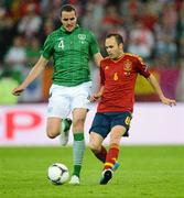 14 June 2012; Andres Iniesta, Spain, in action against John O'Shea, Republic of Ireland. EURO2012, Group C, Spain v Republic of Ireland, Arena Gdansk, Gdansk, Poland. Picture credit: David Maher / SPORTSFILE