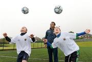 16 June 2012; Chad Cochrane, left, from Boys Model School, Ballysillan Road, Belfast, and Bobbie Burns, St Malacy's College, Antrim Road, Belfast, pictured with top Valencia FC coach, Mr Carlos  De Lera, at the launch of the eFlow-supported Valencia FC soccer camps taking place in Belfast this week. The camps will provide skills training and coaching workshops to over 350 boys and girls over a week-long period in the Michael Hughes Youth Academy, Carrickfergus; Boys Model School and Rosario Football Club. The training camps, aimed at eight to 15 year olds, will be taught by some of Valencia FC’s top coaches including Mr De Lera who has trained top soccer stars such as Spain’s David Silva and Raúl Albiol - both displaying outstanding talent and performance in the Euros in Poland. Saffron Promotions has also played a key role in planning and managing the event. Boys Model School, Ballysillan Road, Belfast, Co. Antrim. Picture credit: Oliver McVeigh / SPORTSFILE
