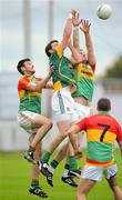 16 June 2012; Brian Meade, Meath, in action against Darragh Foley, Eoghan Ruth, left, and Tony Bolger, 7, Carlow. Leinster GAA Football Senior Championship Quarter-Final Replay, Meath v Carlow, O'Connor Park, Tullamore, Co Offaly. Picture credit: Matt Browne / SPORTSFILE