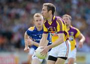 10 June 2012; Redmond Barry, Wexford, in action against Declan Reilly, Longford. Leinster GAA Football Senior Championship, Quarter-Final Replay, Longford v Wexford, O'Connor Park, Tullamore, Co. Offaly. Picture credit: Matt Browne / SPORTSFILE