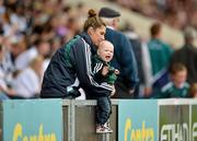 17 June 2012; Joshua Bourke, aged 16 months, from Kildare, cheers on his team with his mother Debbie Kelly during the game. Leinster GAA Football Senior Championship Quarter-Final, Offaly v Kildare, O'Moore Park, Portlaoise, Co. Laois. Picture credit: Barry Cregg / SPORTSFILE