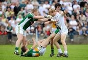 17 June 2012; Tomas O'Connor, Kildare, tussels with Offaly players, from left, Alan Mulhall, Shane Sullivan and Richie Dalton. Leinster GAA Football Senior Championship Quarter-Final, Offaly v Kildare, O'Moore Park, Portlaoise, Co. Laois. Picture credit: Matt Browne / SPORTSFILE