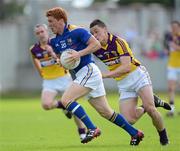 10 June 2012; Paul Kelly, Longford, in action against Lee Chin, Wexford. Leinster GAA Football Senior Championship, Quarter-Final Replay, Longford v Wexford, O'Connor Park, Tullamore, Co. Offaly. Picture credit: Matt Browne / SPORTSFILE