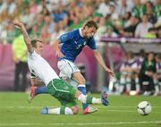 18 June 2012; Claudio Marchisio, Italy, is tackled by Glenn Whelan, Republic of Ireland. EURO2012, Group C, Republic of Ireland v Italy, Municipal Stadium Poznan, Poznan, Poland. Picture credit: Brendan Moran / SPORTSFILE