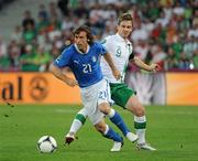 18 June 2012; Andrea Pirlo, Italy, in action against Kevin Doyle, Republic of Ireland. EURO2012, Group C, Republic of Ireland v Italy, Municipal Stadium Poznan, Poznan, Poland. Picture credit: Brendan Moran / SPORTSFILE