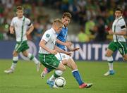 18 June 2012; Damien Duff, Republic of Ireland, in action against Claudio Marchisio, Italy. EURO2012, Group C, Republic of Ireland v Italy, Municipal Stadium Poznan, Poznan, Poland. Picture credit: Brendan Moran / SPORTSFILE